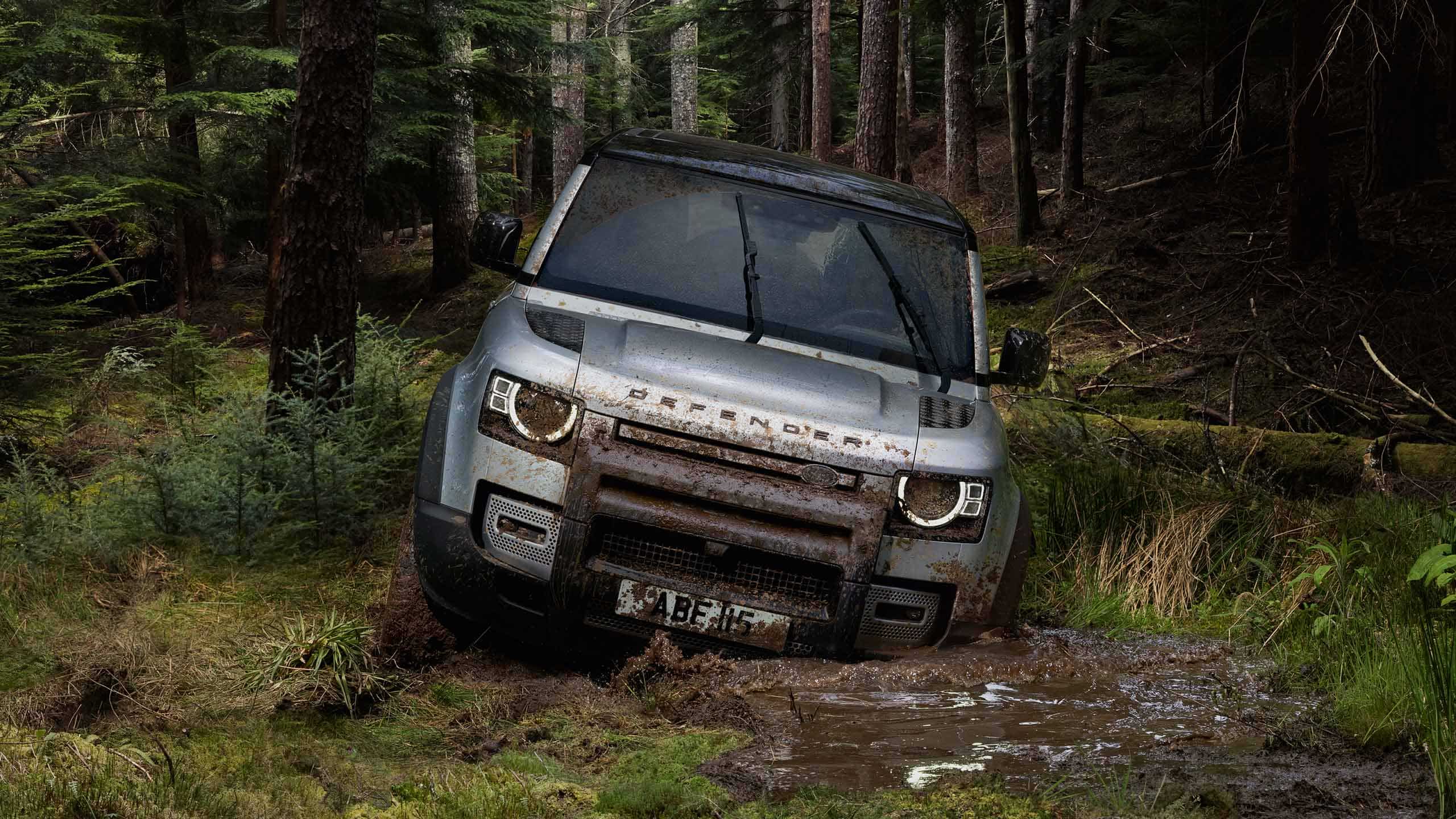 Range Rover Defender driving in mud