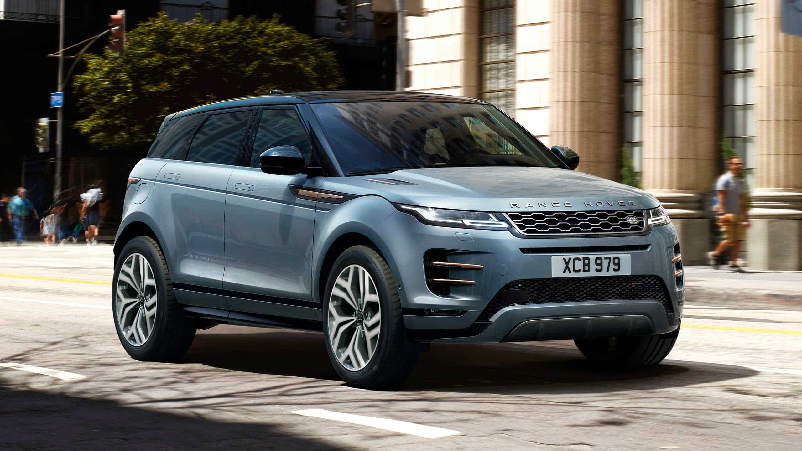 Range Rover Evoque (blue) driving on road