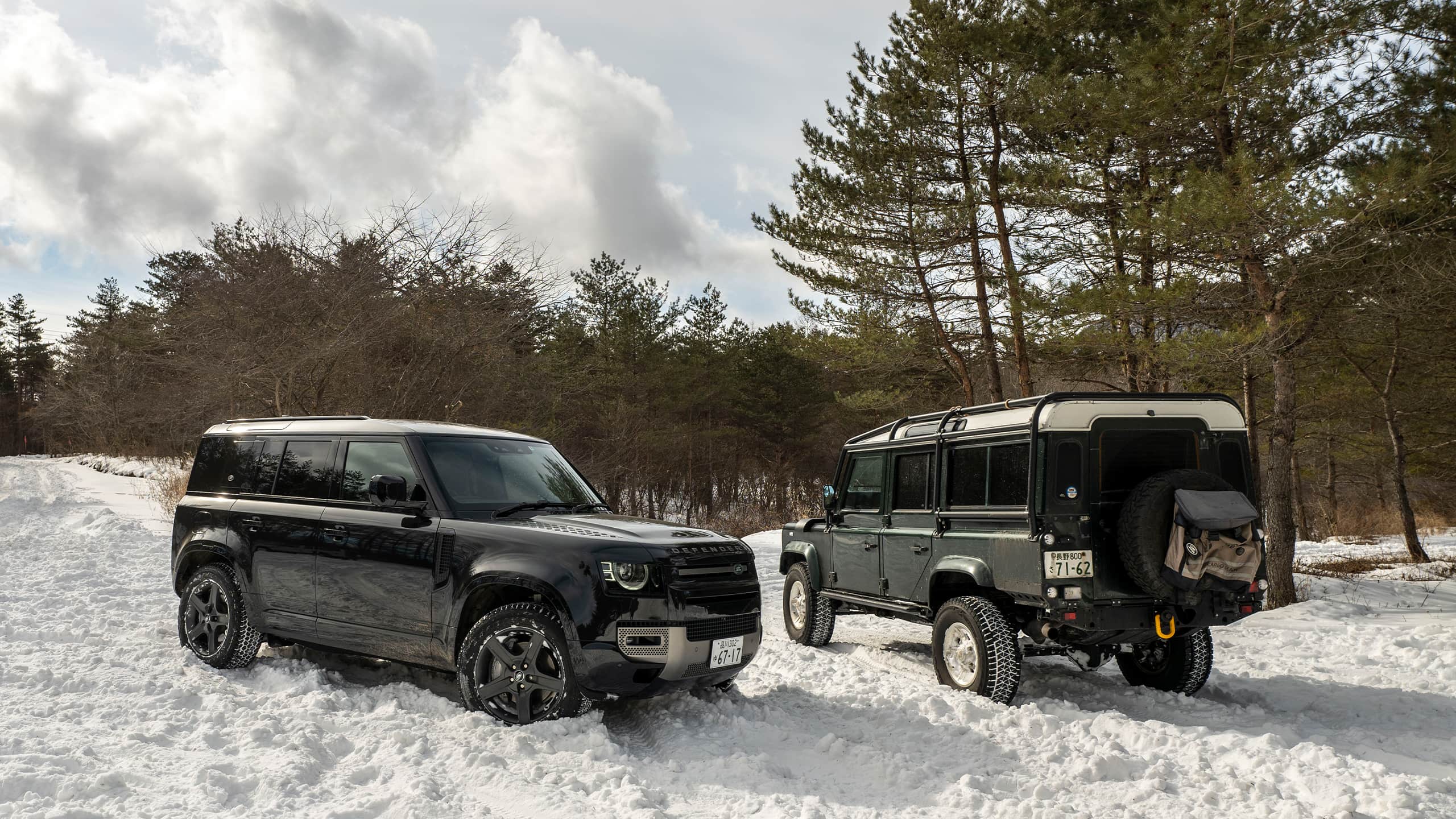 Two Two Defender Parked at Snow Forest Area Road