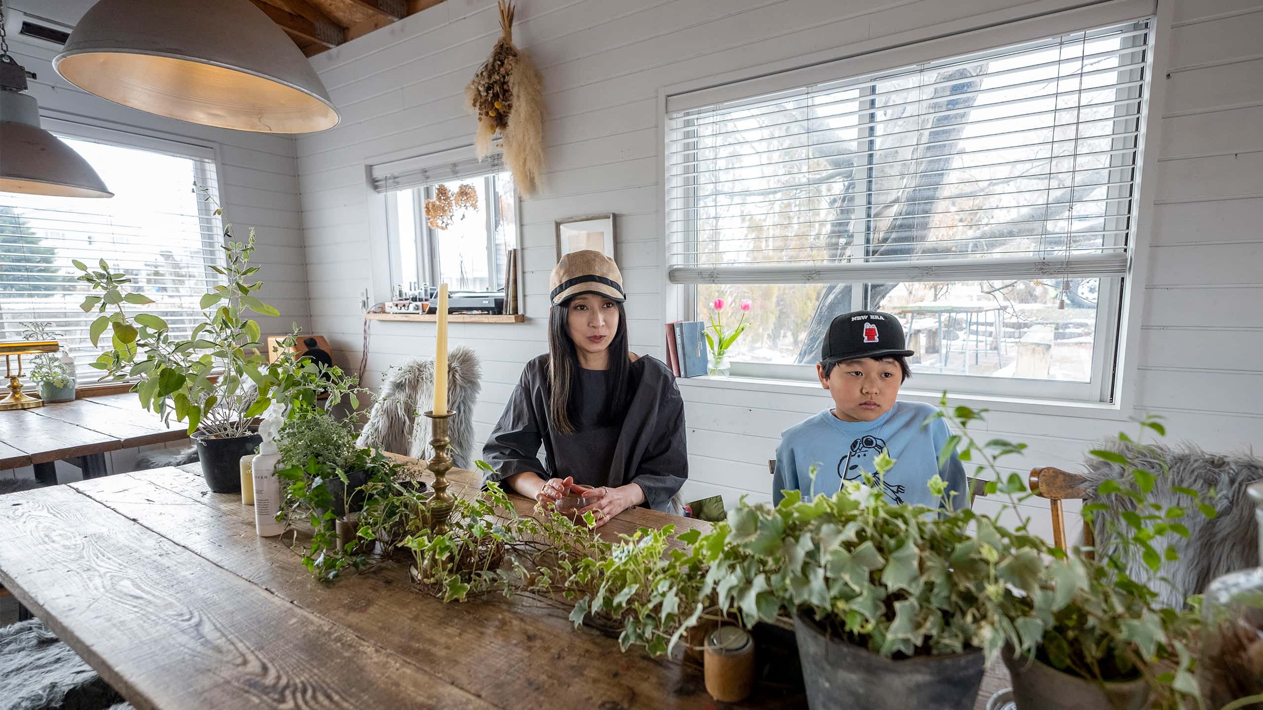 Mother and Son selling Plants