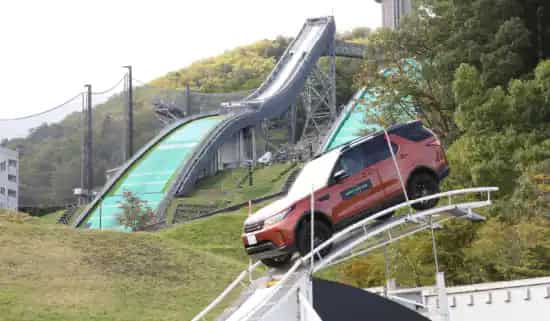 Car driving down a slope