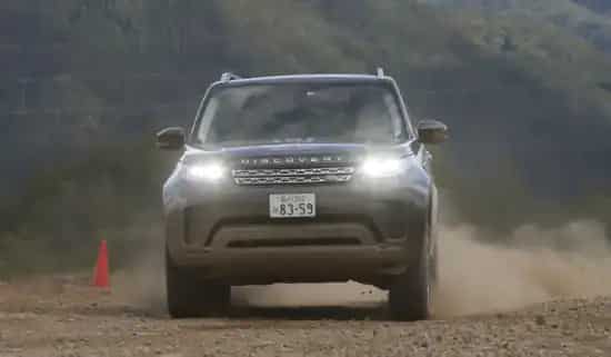 Range Rover Discovery through dirt track