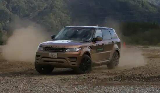 Range Rover driving through dirt